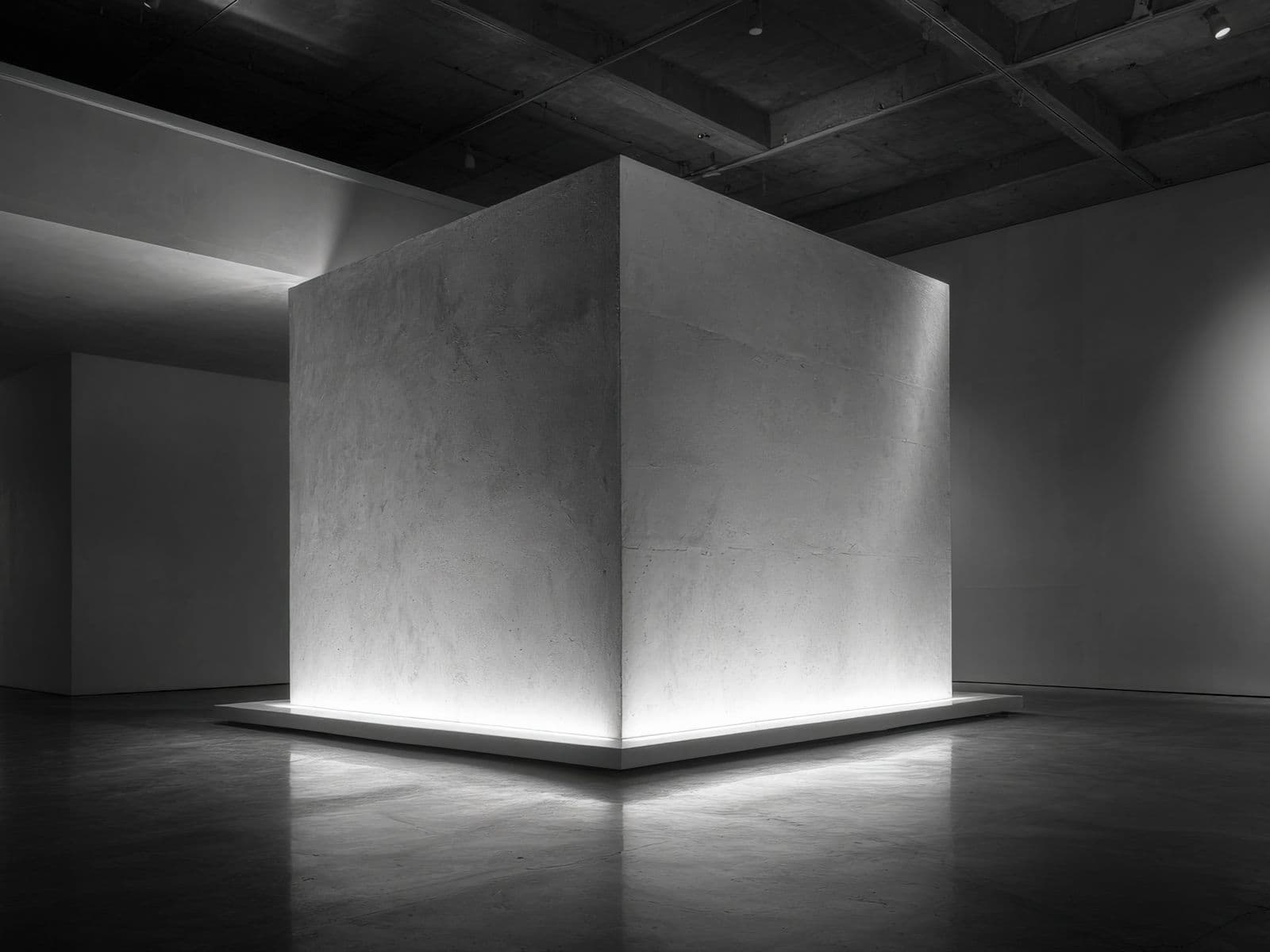 Monumental cube sculpture in an open plaza